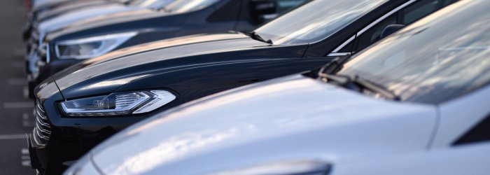 Parking car dealership  with luxury models in row