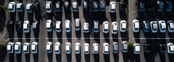 Abundance of cars in crowded parking lot generated by artificial intelligence